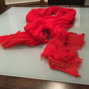 Red scarf with gold thread accents